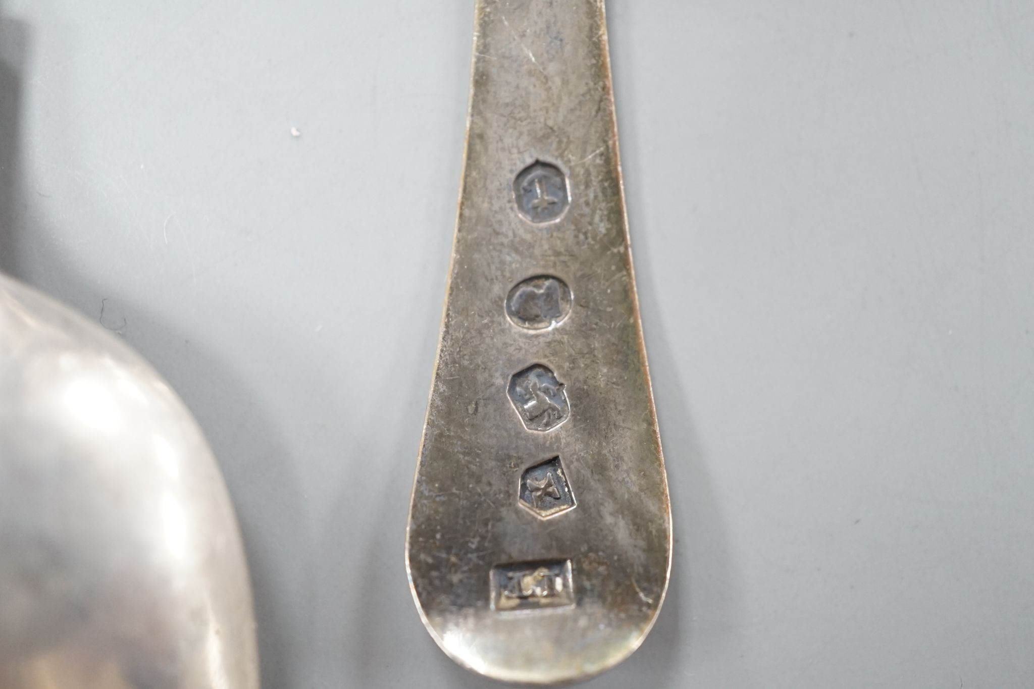 A set of six early Victorian silver fiddle pattern teaspoons, Charles Boyton, London, 1844 and a George IV silver caddy spoon, Birmingham, 1821, 3.5oz.